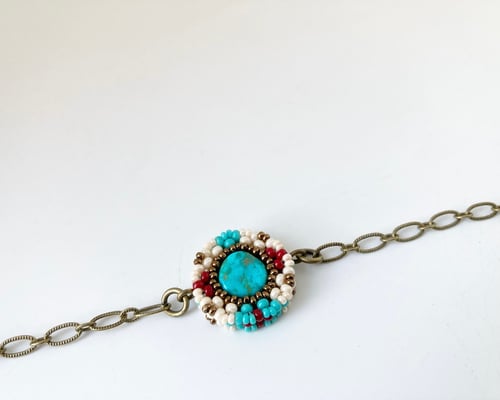 Image of Beaded circular charm single chain bracelet 