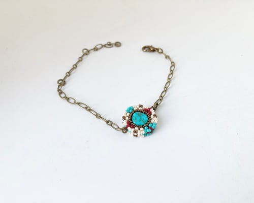 Image of Beaded circular charm single chain bracelet 