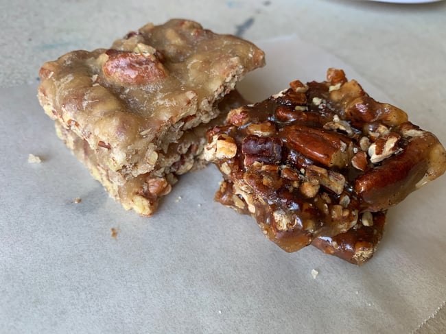 Mixed nut brittle in a tin