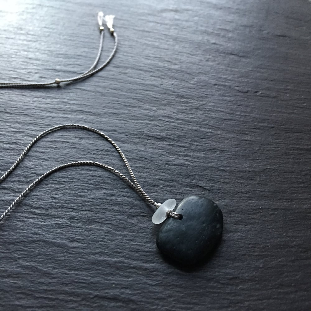 Image of Black stone with white sea glass - Devon