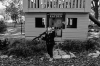 Young kid with jukebox and gun 