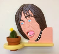 Image 1 of Iggy Pop yells at a plant