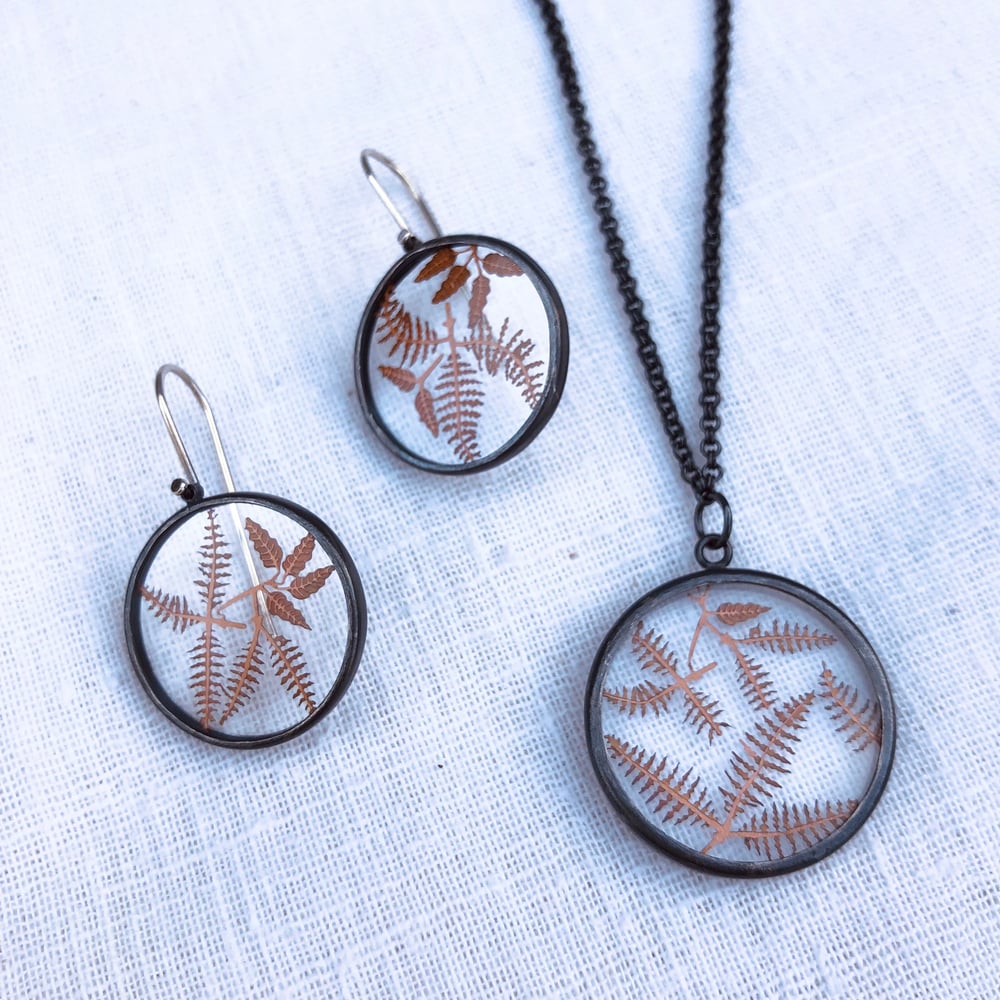 Image of Copper fern botanicals under glass