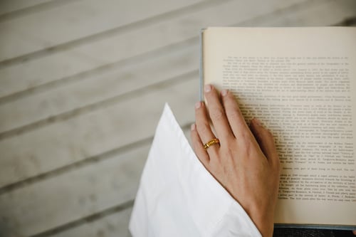 Image of gold plated silver hexagon ring with inscription in Latin