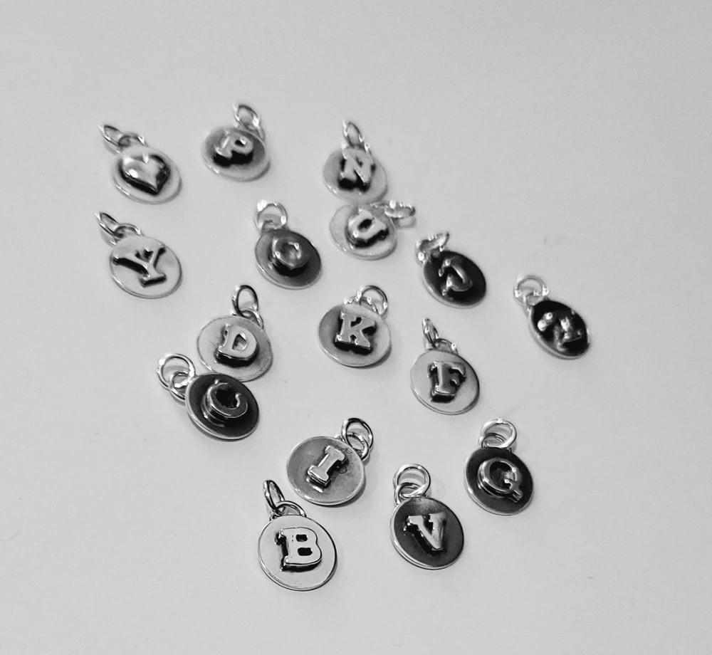 Image of initial charms