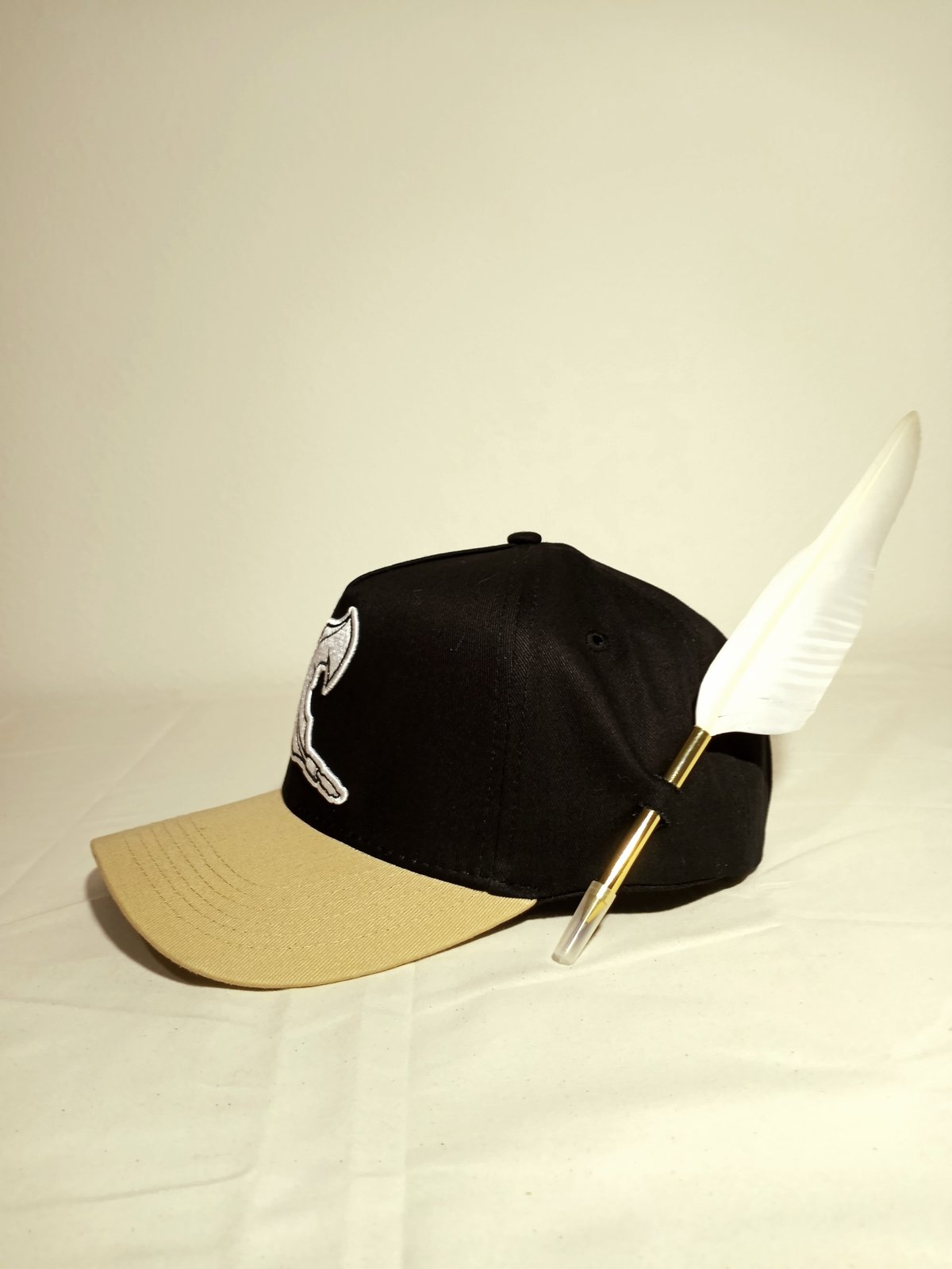 white feather logo cap | Caligra