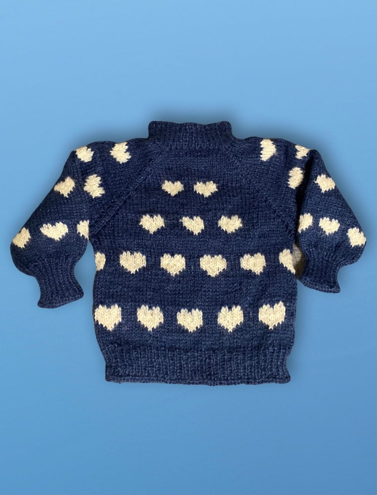 Image of blue sweater with white hearts