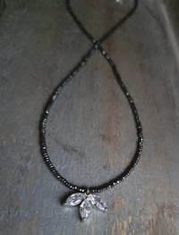 Image 2 of Minimalist Cubic Zirconia (CZ) Flower Pendant on a Necklace of Tiny Sparkly Hematite Beads