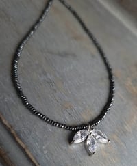 Image 1 of Minimalist Cubic Zirconia (CZ) Flower Pendant on a Necklace of Tiny Sparkly Hematite Beads