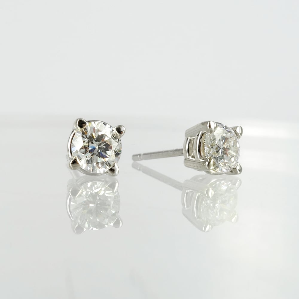 Image of 14ct white gold diamond stud earrings, set with 2 diamonds = .60ct GSI3. Pj6010