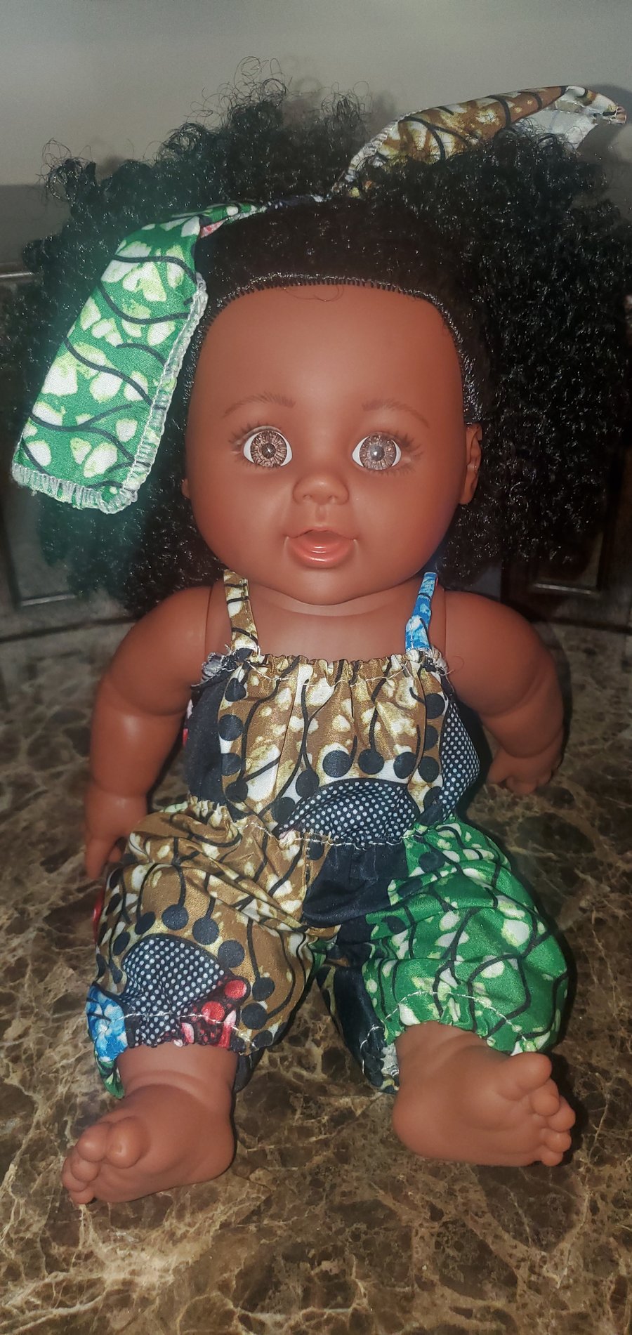 Image of K-lock doll (brown and green jumpsuit)