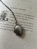 Pendentif en argent massif ouvrant porte-mèche ou porte-photo, fin du XIXème siècle