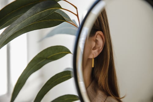 Image of gold plated light plain silver earrings with inscription in Latin