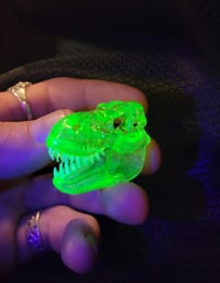 Image 1 of Illuminati and crushed opal Tyrannosaurus rex skull pendant. (UV reactive)