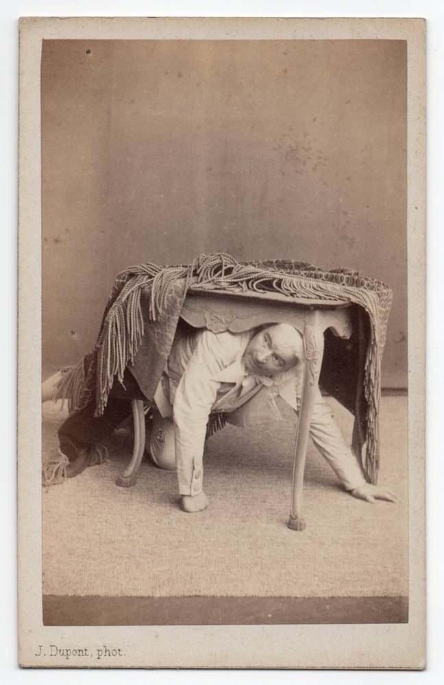 Image of Joseph Dupont: actor hiding under table, Antwerp ca. 1865