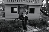 Child with gun and juice-box in BNW 2