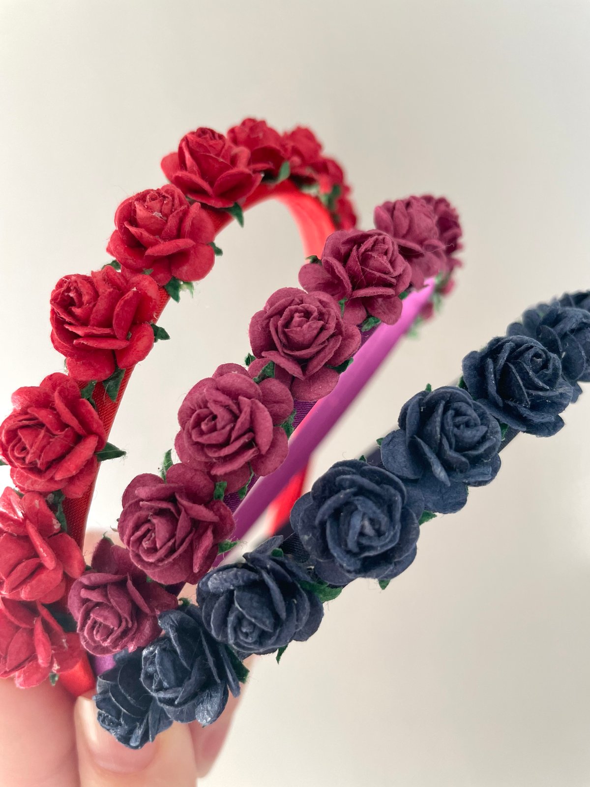 red rose hair band photographed on a white background Stock Photo - Alamy