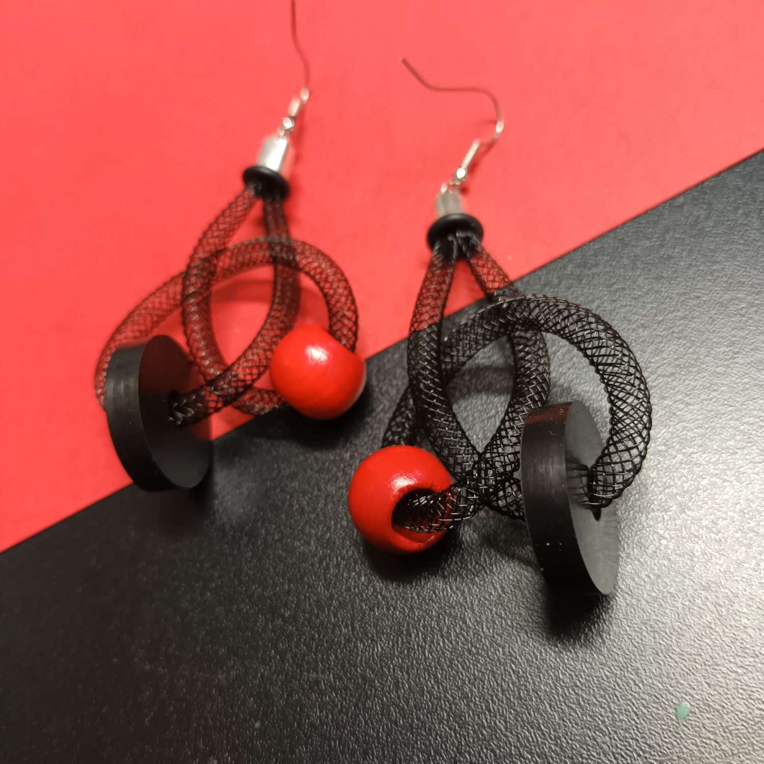 Image of medium size mesh knot earrings black/red