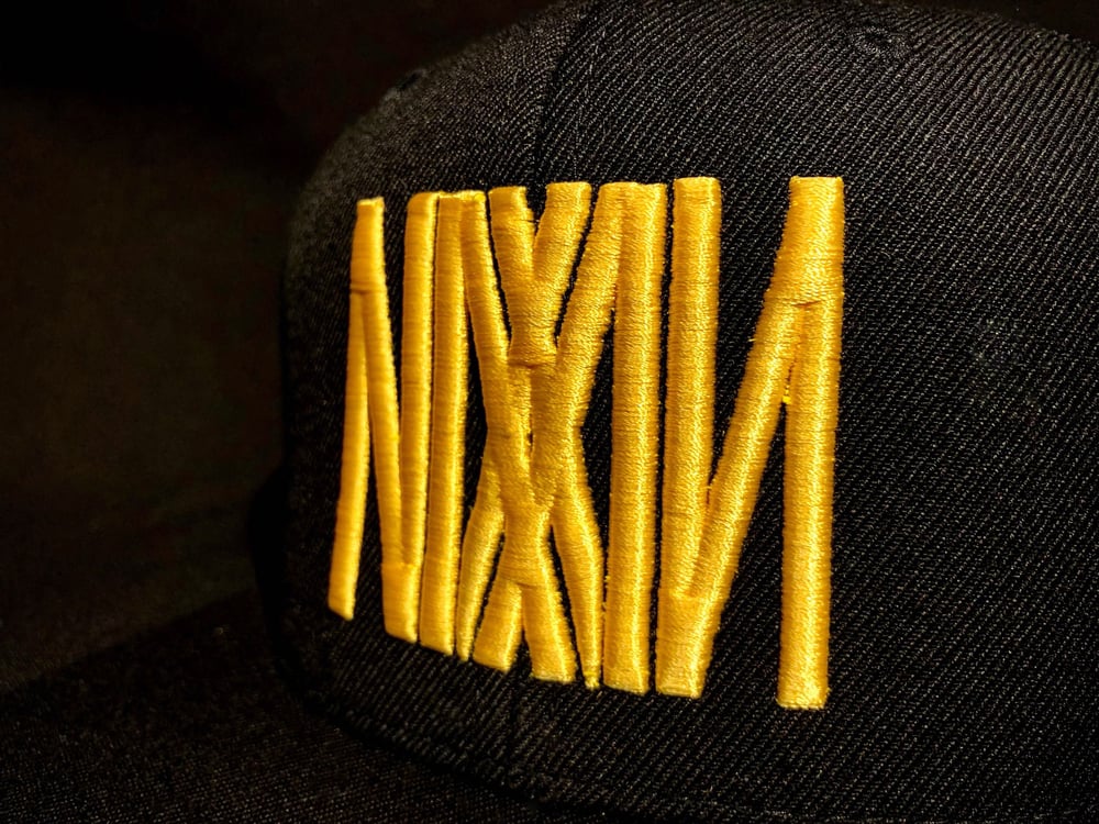 "NIXXIN" Logo Flat Bill Trucker Hat (Blk/Yellow)