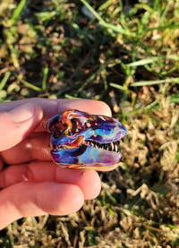 Image 2 of Amber purple Tyrannosaurus rex skull pendant.