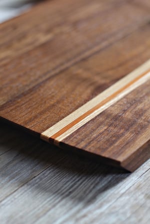 Image of Charcuterie or cheese serving board with colorful inlays