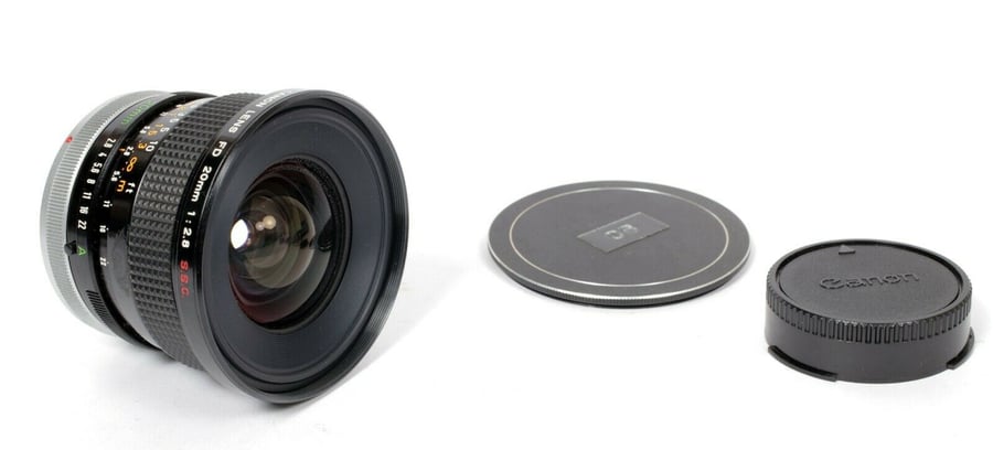 Image of Canon FD 20mm F2.8 S.S.C. lens with caps