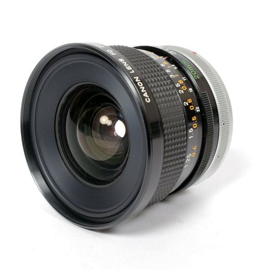 Image of Canon FD 20mm F2.8 S.S.C. lens with caps