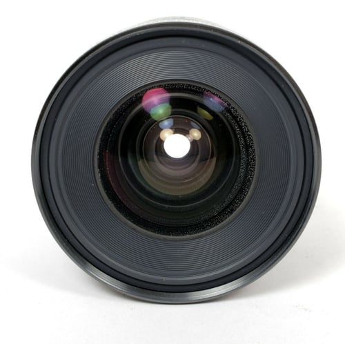 Image of Canon FD 20mm F2.8 S.S.C. lens with caps