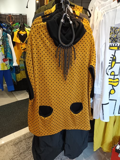Image of yellow and black polkadots sweater