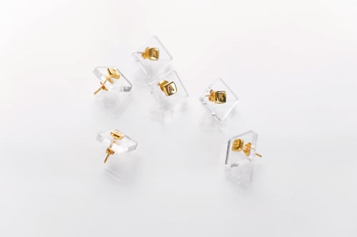 Image of gold plated silver earring with letter