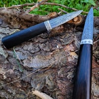 pair of bog out folded steel belt knives