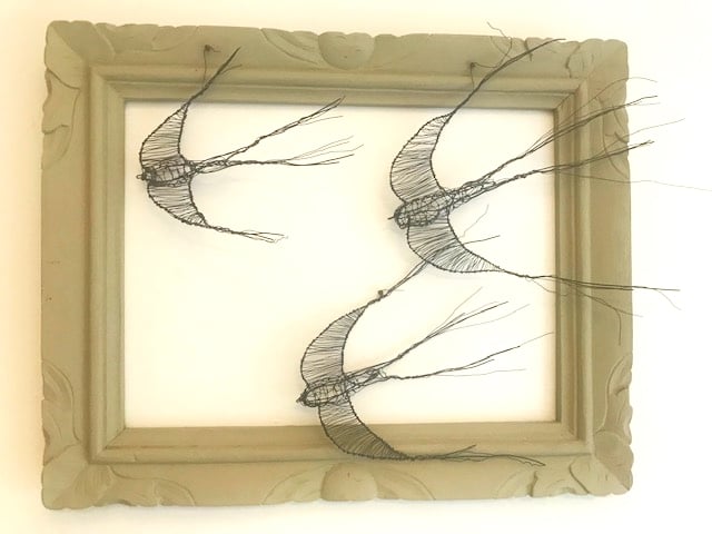 Three wire swallows in a frame