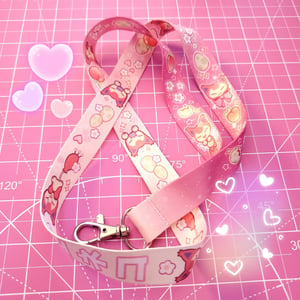 Image of peachy skitty lanyard 