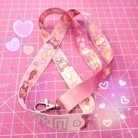 Image 2 of peachy skitty lanyard 