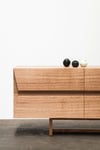 CLIPPED WING SIDEBOARD IN TASMANIAN OAK WITH TIMBER BASE