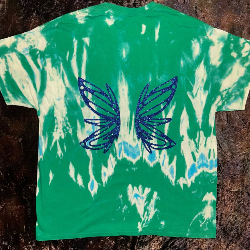 Image of green bleach dye tshirt with fairy wing design