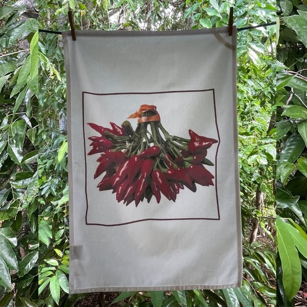 Image of Tea towel:  Red Chillies by Chips Mackinolty 