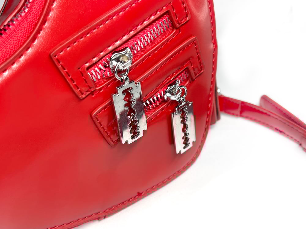 Heart shaped Purse with Razors