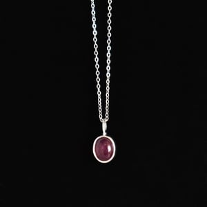 Image of Vietnam Red Star Ruby oval shape cabochon cut silver necklace