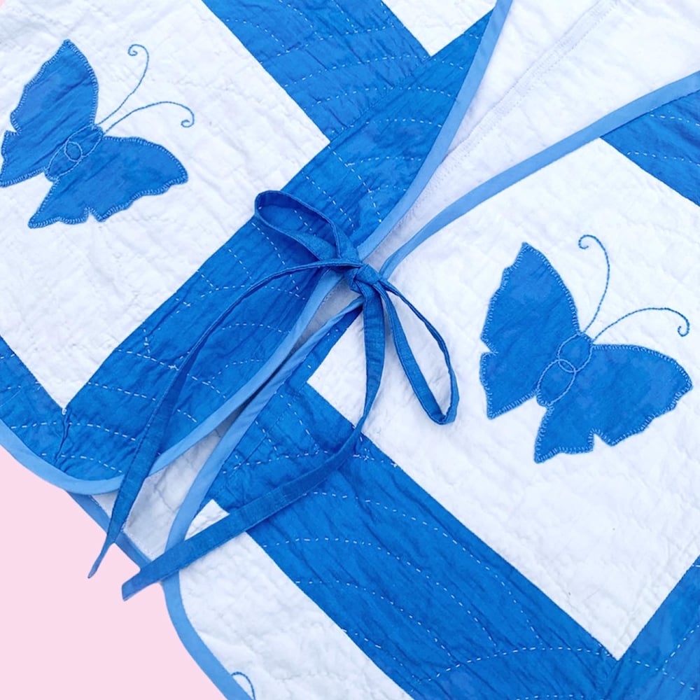 Image of Quilted Cropped Front-Tie Vest — Blue Butterflies