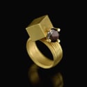 2 carat salt and pepper brown diamond intersected by a hollow-form cuboid in 18ct Gold