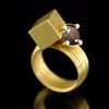 2 carat salt and pepper brown diamond intersected by a hollow-form cuboid in 18ct Gold