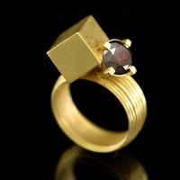 Image 1 of 2 carat salt and pepper brown diamond intersected by a hollow-form cuboid in 18ct Gold