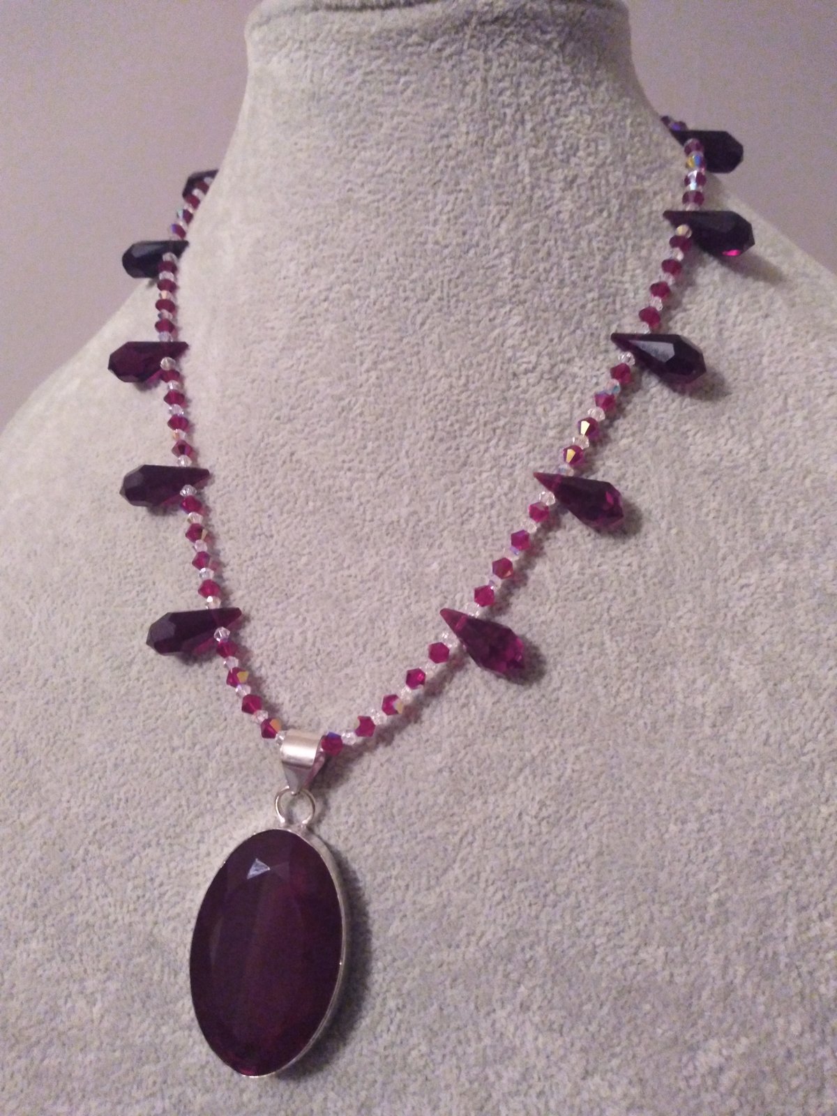 Garnet and Sterling Silver Pendant Necklace from Bali - Glowing Paws |  NOVICA