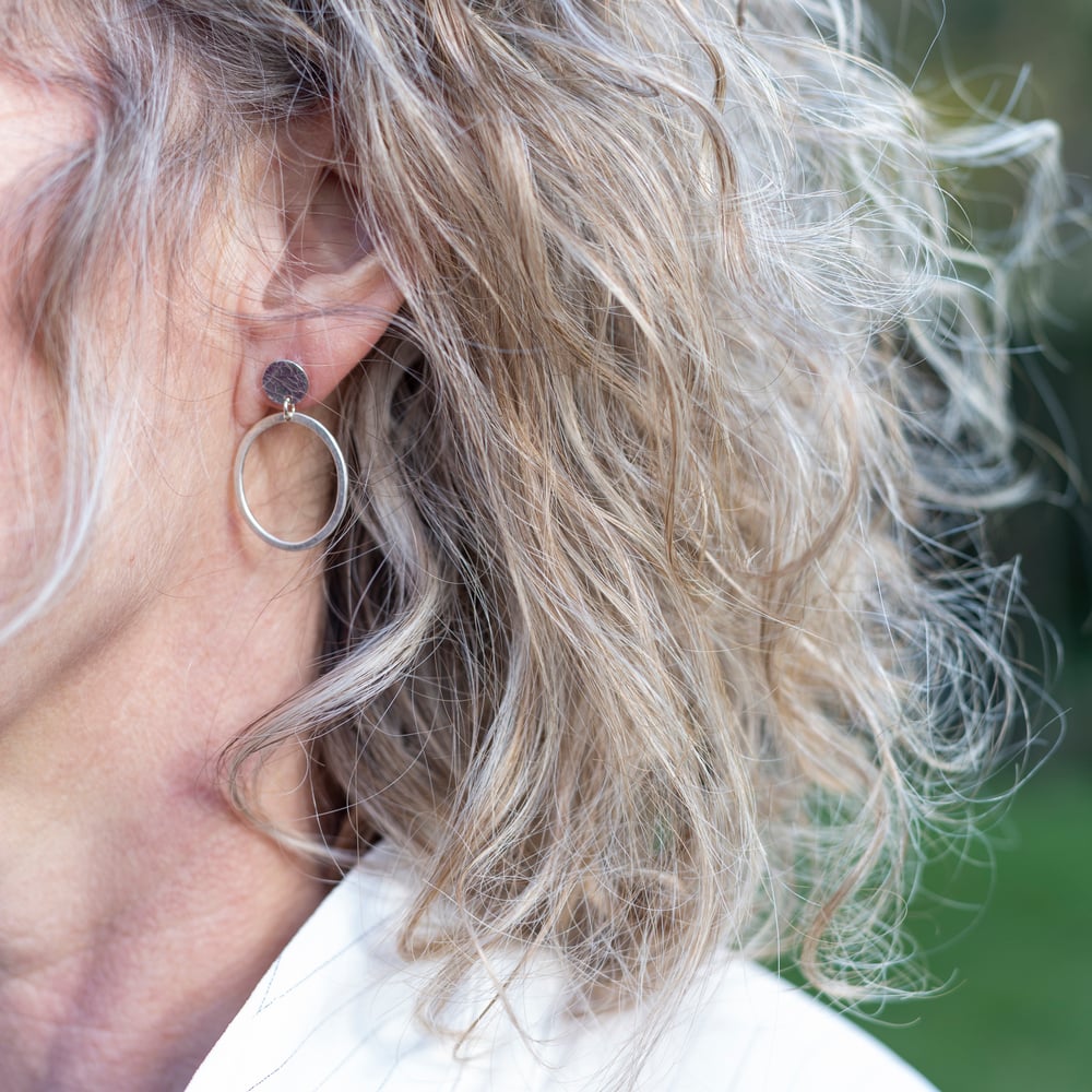 Image of Recycled sterling silver circle stud and oval dangly earrings. 