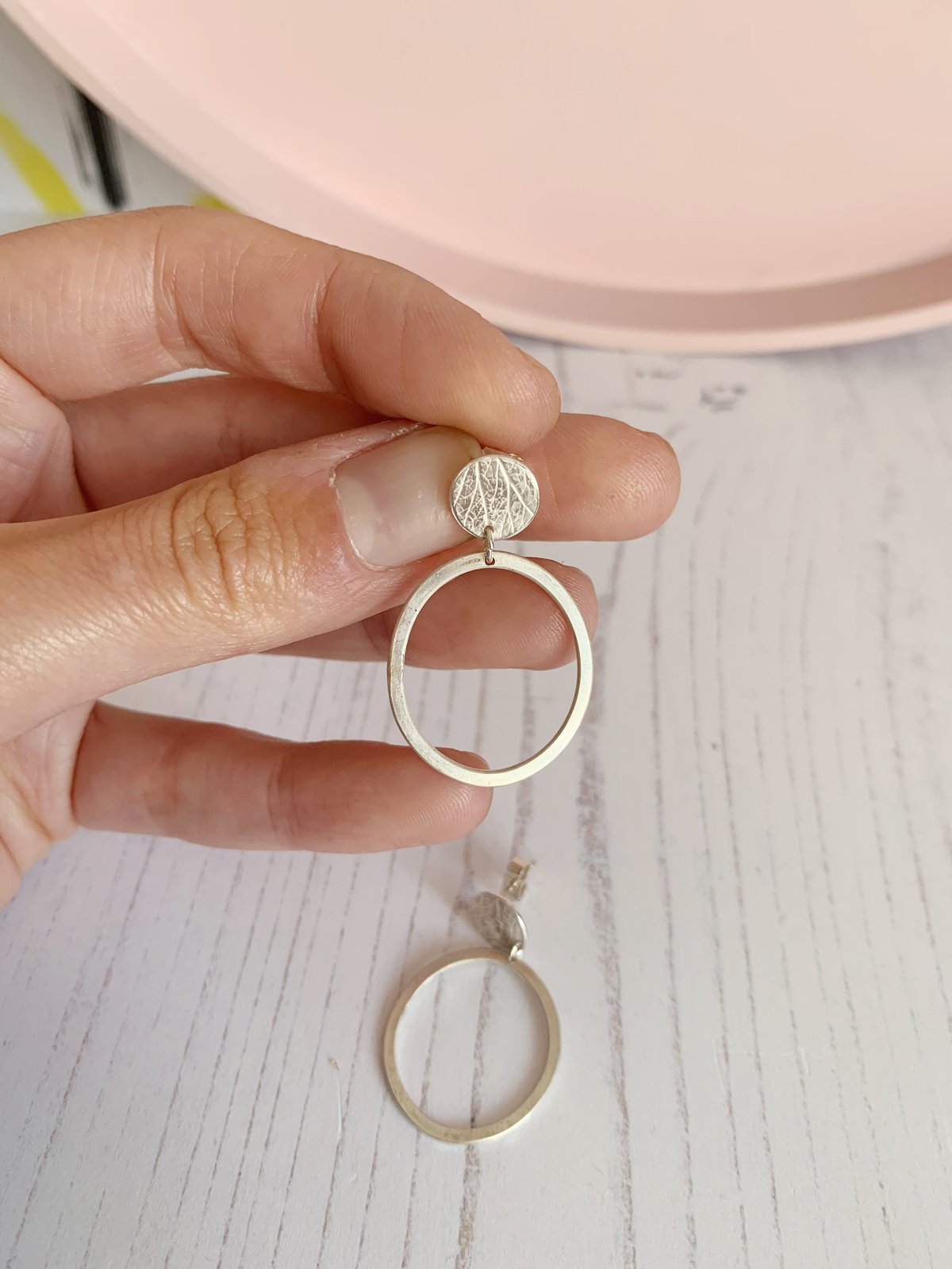 Image of Recycled sterling silver circle stud and oval dangly earrings. 