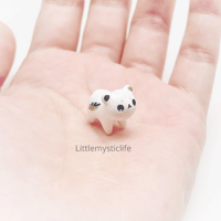 Image 1 of Tiny leaf bear figurine