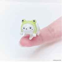 Image 1 of bear with frog hat figurine