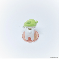 Image 5 of bear with frog hat figurine