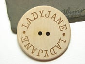 Image of flat wood buttons for branding your products